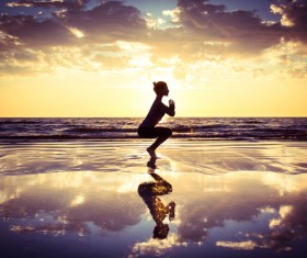 Backlight shooting sunrise beach practicing yoga woman Stock Photo 04