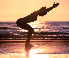 Backlight shooting sunrise beach practicing yoga woman Stock Photo 07