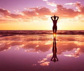 Backlight shooting sunrise beach practicing yoga woman Stock Photo 09