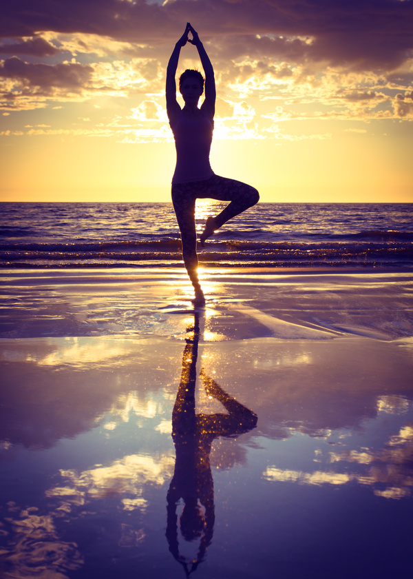 Backlight shooting sunrise beach practicing yoga woman Stock Photo 10