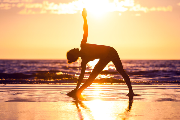 Backlight shooting sunrise beach practicing yoga woman Stock Photo 11
