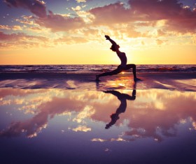 Backlight shooting sunrise beach practicing yoga woman Stock Photo 14
