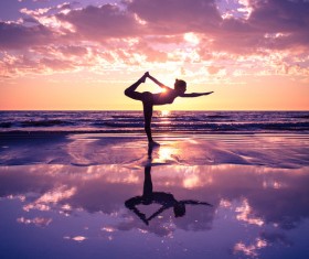 Backlight shooting sunrise beach practicing yoga woman Stock Photo 15