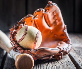 Baseball glove and a baseball bat Stock Photo