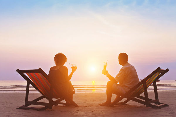 Beach couple watching sunset HD picture