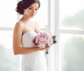 Beautiful bride standing at the window Stock Photo 03