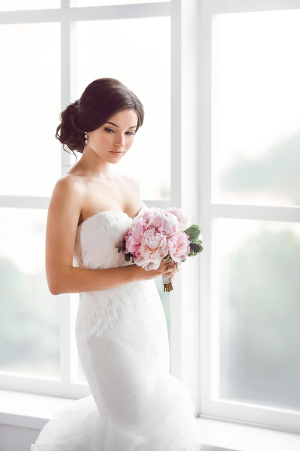 Beautiful bride standing at the window Stock Photo 03