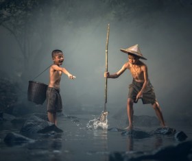 Cambodian children catch fish Stock Photo