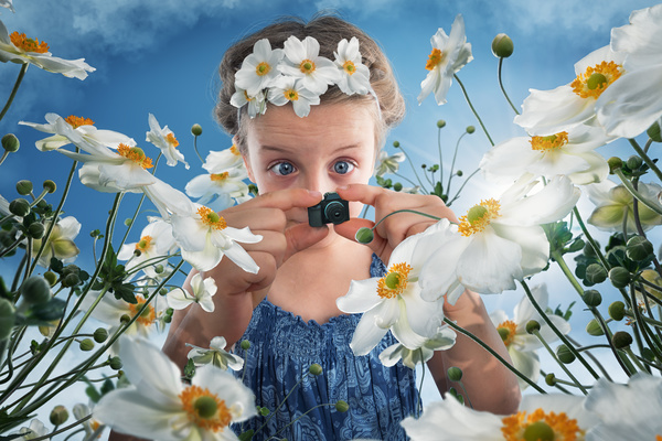 Children who are photographed with a miniature camera Stock Photo