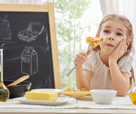 Children who eat delicious pancakes Stock Photo
