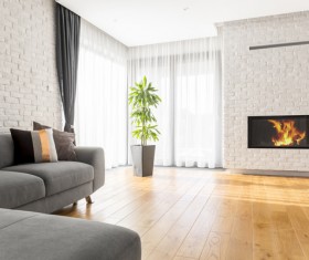 Corner sofa with large plant fireplace living room Stock Photo 01