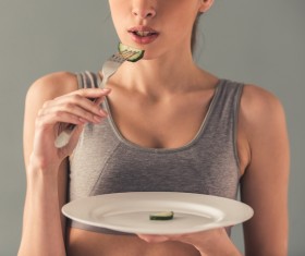 Eat cucumber to lose weight of a woman Stock Photo
