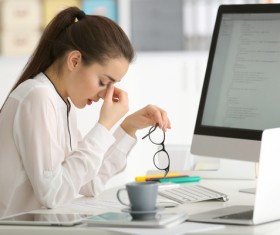Eyes closed rest of female programmers Stock Photo