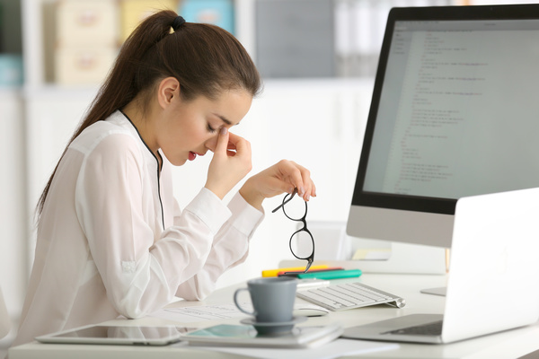 Eyes closed rest of female programmers Stock Photo