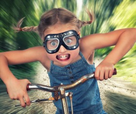 Funny face of child cyclists Stock Photo