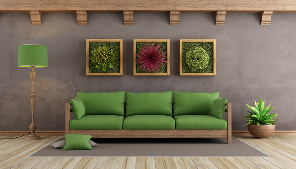 Green sofa pad with wall plant painting Stock Photo