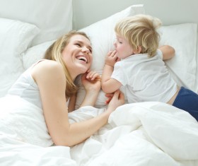 Happy mother and child bed Stock Photo