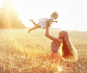 Happy mother and child in the wheat field HD picture