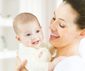 Happy mother holding the baby Stock Photo