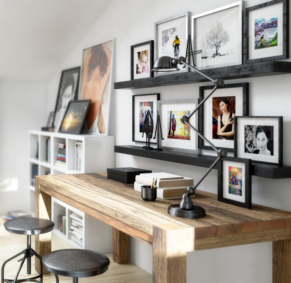 His study desk and wall photos Stock Photo