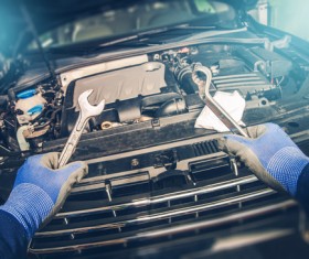 Holding a service tool vehicle maintenance staff Stock Photo