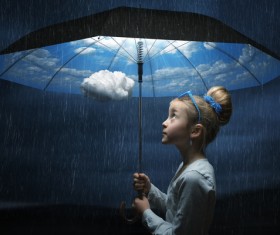 Little girl holding the magic umbrella Stock Photo