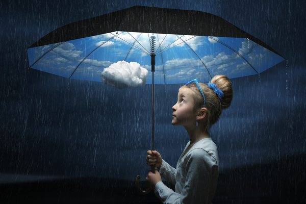 Little girl holding the magic umbrella Stock Photo