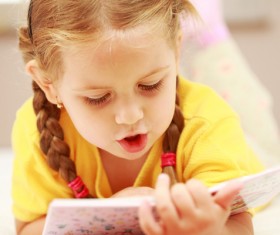 Little girl reading Stock Photo