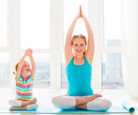 Mother and little girl doing exercise Stock Photo 03