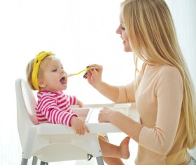Mother feed baby to eat Stock Photo 01