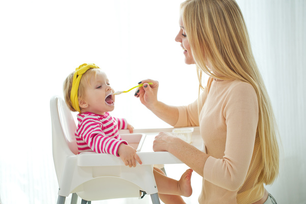 Mother feed baby to eat Stock Photo 01