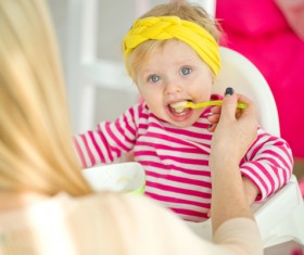 Mother feed baby to eat Stock Photo 02
