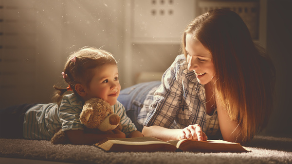 Mother tells the story to the child Stock Photo