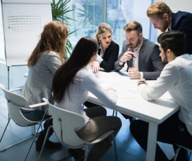 People get together to discuss the business plan Stock Photo