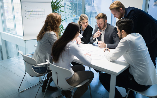 People get together to discuss the business plan Stock Photo