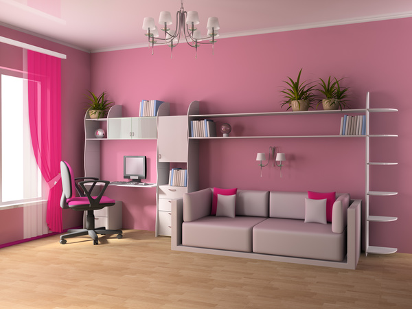 Pink wall with small sofa and computer desk Stock Photo