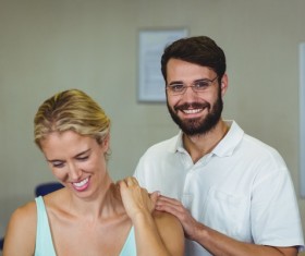 Rehabilitators and female patients Stock Photo