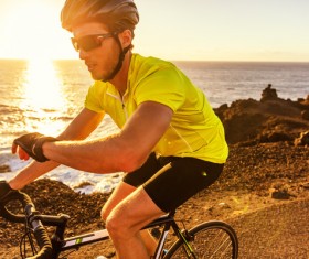 Seaside cycling man Stock Photo