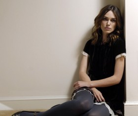 Sitting in the corner sad beauty Stock Photo