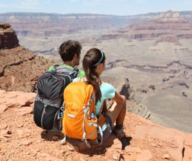 Sitting on the hills to see the view of the hikers Stock Photo