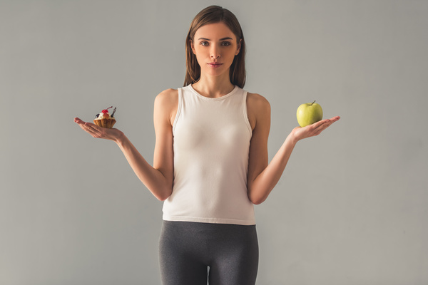 Slim figure of the woman with food Stock Photo