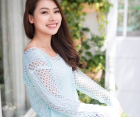 Smiling Asian girl on the balcony HD picture