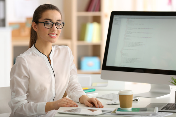 Smiling female programmer working in the office Stock Photo 01 free download