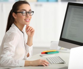 Smiling female programmer working in the office Stock Photo 02
