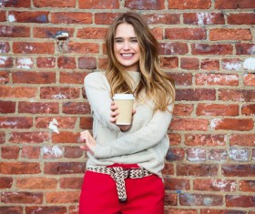 Smiling girl holding instant coffee HD picture