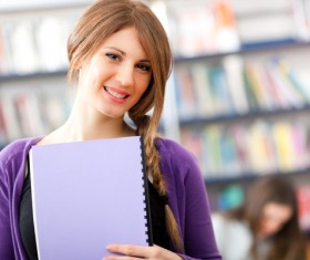 Students holding textbooks Stock Photo