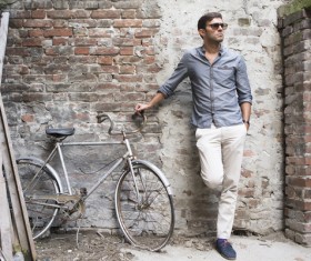Stylish men with dilapidated bikes HD picture