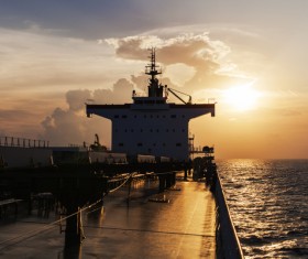Sunset sea cargo ship Stock Photo