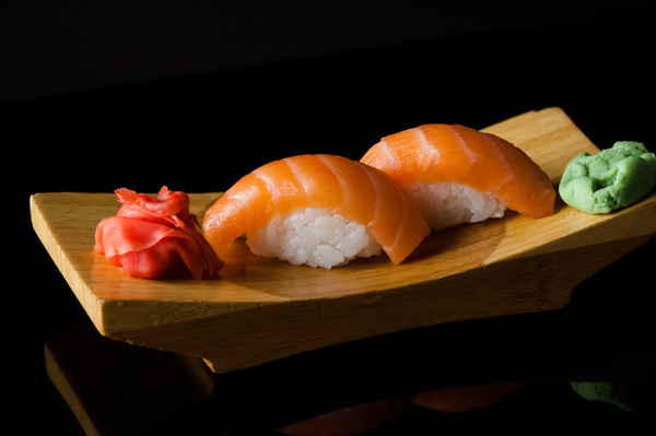Sushi in a plate on a black background Stock Photo 01