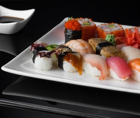 Sushi in a plate on a black background Stock Photo 07